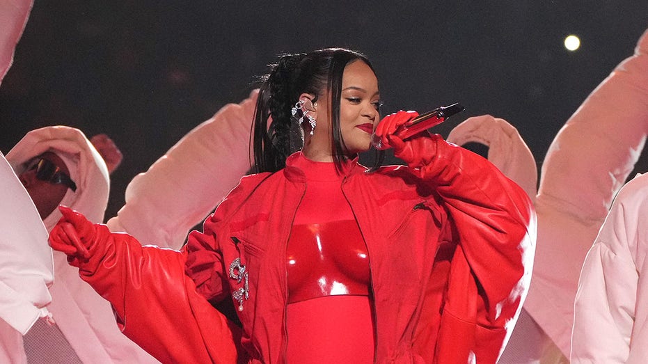 Rihanna singing in red coat at the Super Bowl