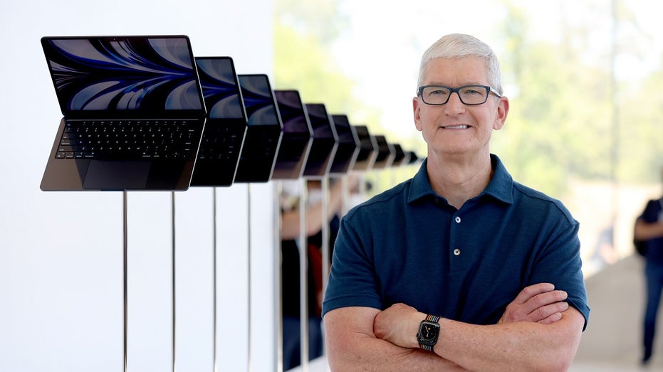 Apple CEO Tim Cook with MacBooks
