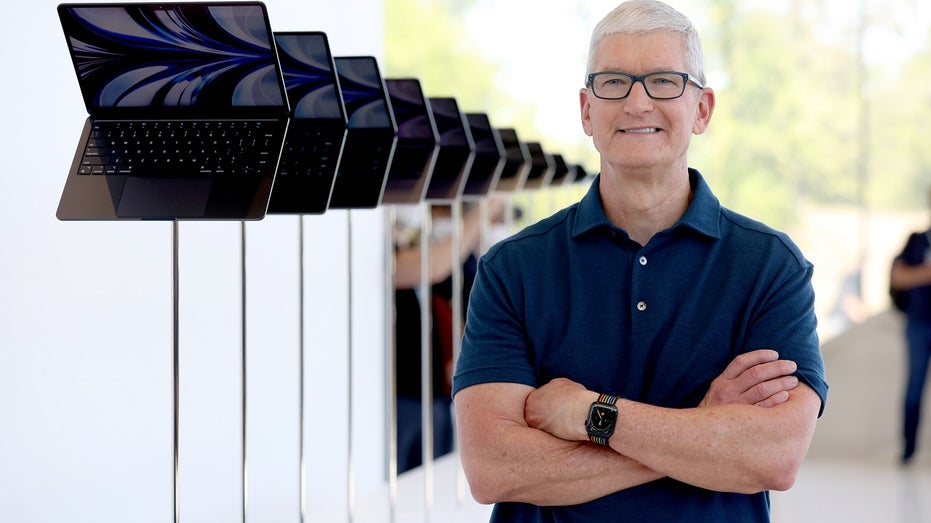 Apple CEO Tim Cook with MacBooks