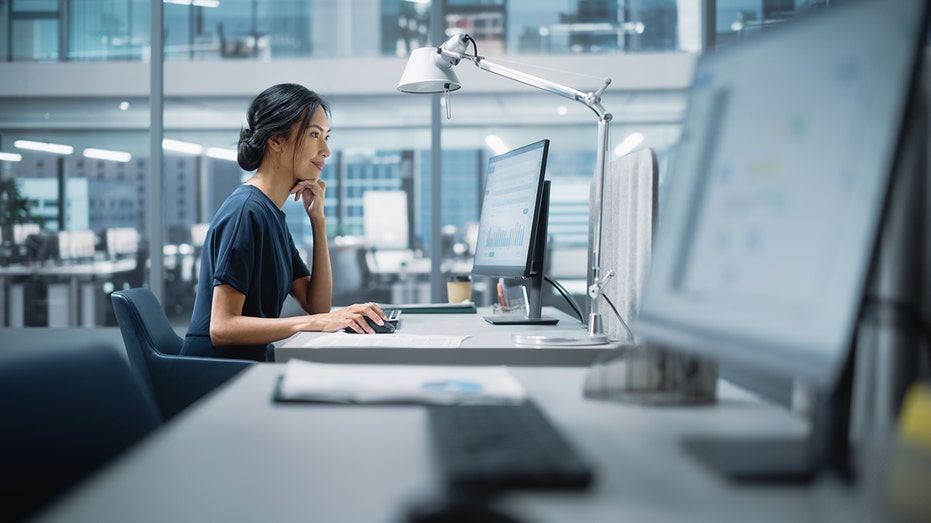 woman on office computer