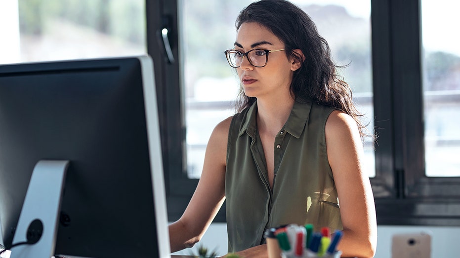 Woman working on a computer at work