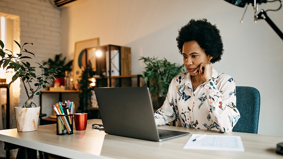 woman working on computer at home