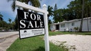 A &apos;for sale&apos; sign hangs in front of a home on June 21, 2022 in Miami, Florida. According to the National Association of Realtors, sales of existing homes dropped 3.4% to a seasonally adjusted annualized rate of 5.41 million units. Sales were 8.6% lower than in May 2021. As existing-home sales declined, the median price of a house sold in May was $407,600, an increase of 14.8% from May 2021. (Photo by Joe Raedle/Getty Images)
