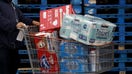 A shopper pushes a cart with paper towels, water and diapers from a Costco Wholesale Corp. location in Hawthorne, California, U.S., on Saturday, March 14, 2020. Costco is struggling to keep items in stock, Chief Financial Officer Richard Galanti told analysts, saying the buying frenzy has been "a little bit crazy." Photographer: Patrick T. Fallon/Bloomberg via Getty Images
