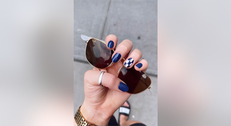 Navy blue and white checkerboard manicure