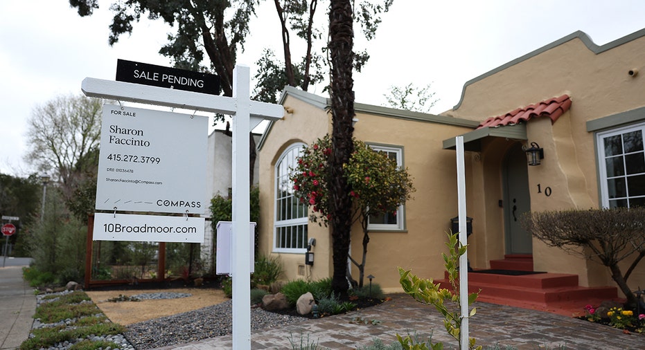 For sale sign posted in front of California home