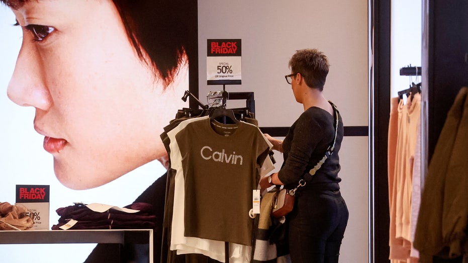 Person looking at rack in clothing store