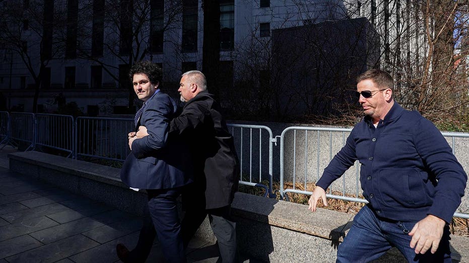 Sam Bankman-Fried walks outside the Manhattan federal court in New York City.