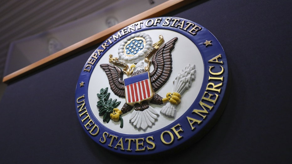A U.S. State Department logo