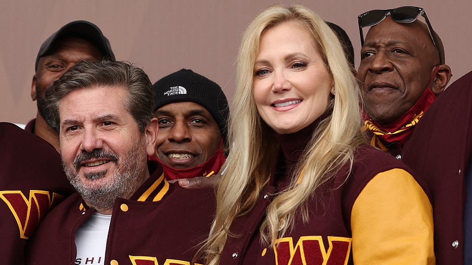 Commanders co-owners Dan and Tanya Snyder pose for a photo