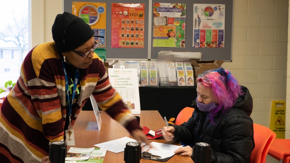 Kimberly Bungard signs up for the monthly groceries