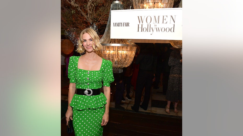 January Jones in a green polka dot dress at an event