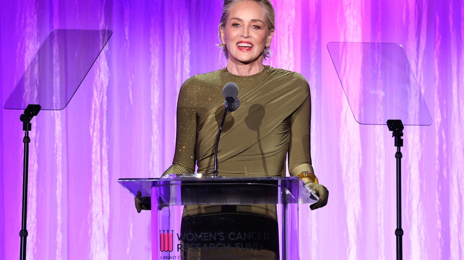 Sharon Stone stands behind podium at fundraiser