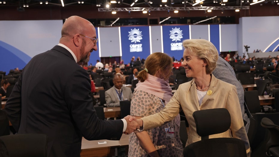 President of the European Council Charles Michel and President of the European Commission Ursula von der Leyen shake hands