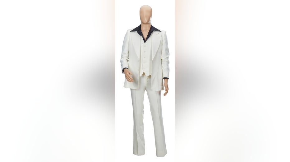 A mannequin wearing John Travoltas white suit from "Saturday Night Fever"
