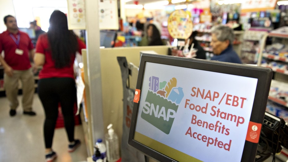 "SNAP/EBT Food Stamp Benefits Accepted" is displayed on a screen