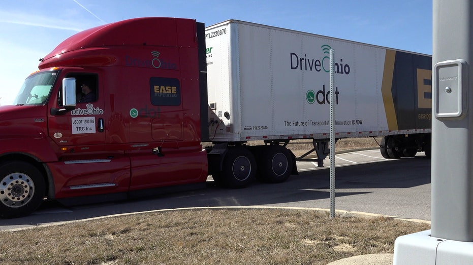 Semi-truck with ODOT and Drive Ohio branding parked on the road
