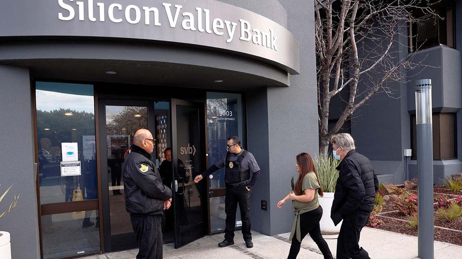 A customer is escorted into the Silicon Valley Bank headquarters