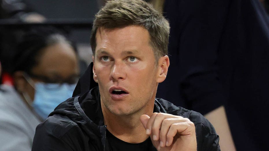 Tom Brady watches an Aces game