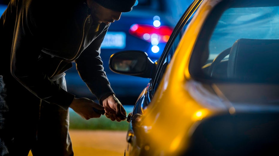 car thief trying to steal a car