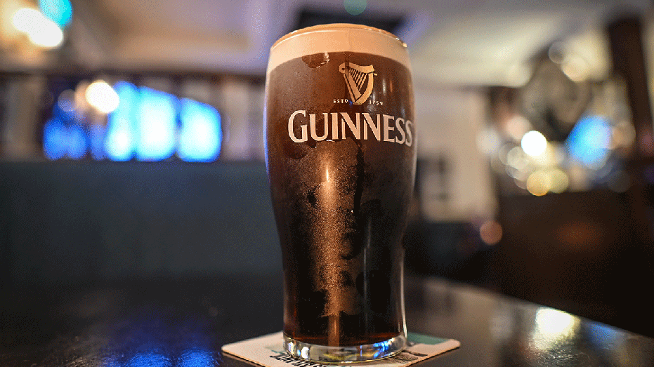 A glass of Guinness on a table