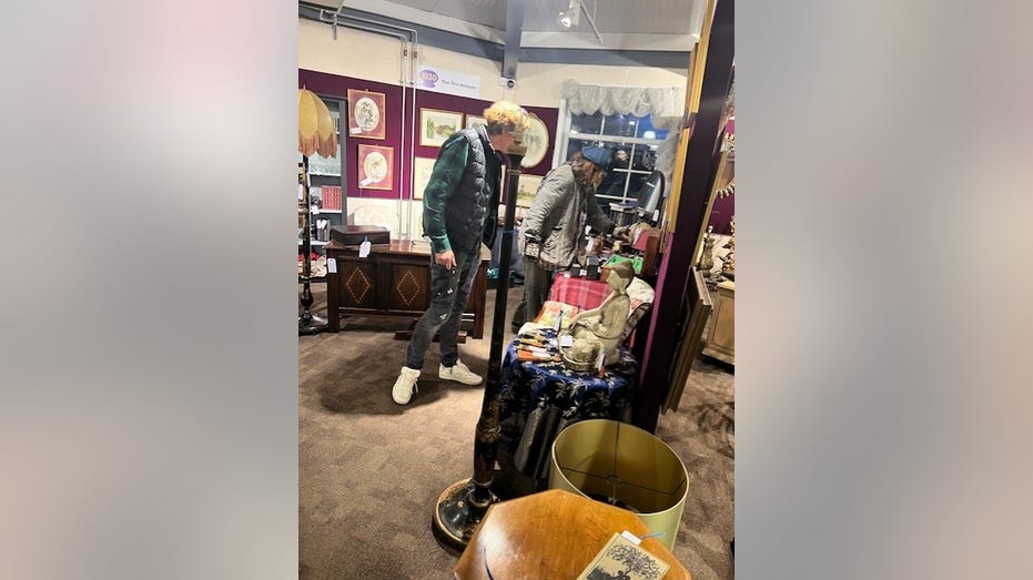 Johnny Depp looking at antiques