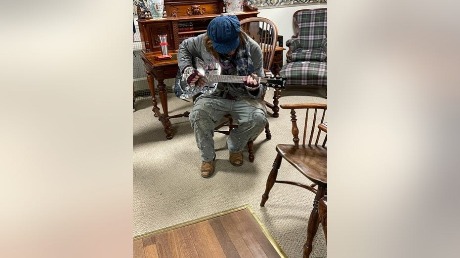 Johnny Depp playing a guitar