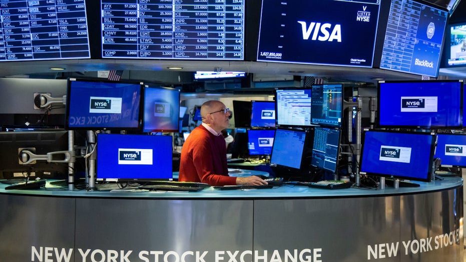 A trader works on the floor of the New York Stock Exchange (NYSE) in New York, US