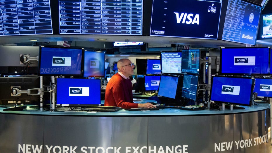 A trader works on the floor of the New York Stock Exchange (NYSE) in New York, US