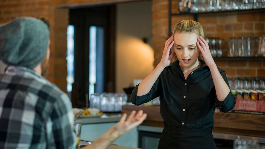 customer yelling at stressed waitress