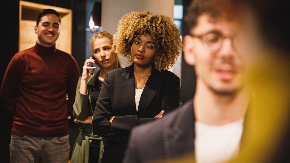 customers waiting in line at a business