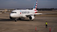 American Airlines beats profit estimates, sees strong holiday bookings
