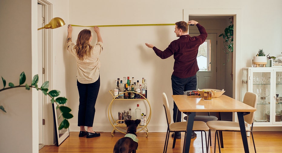 Millennial couple decorates apartment