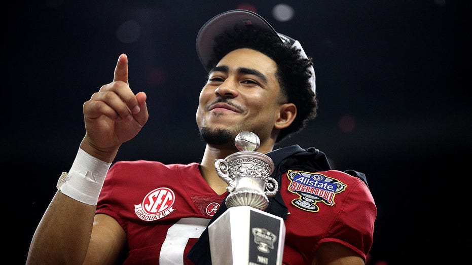 Bryce Young celebrates after a game