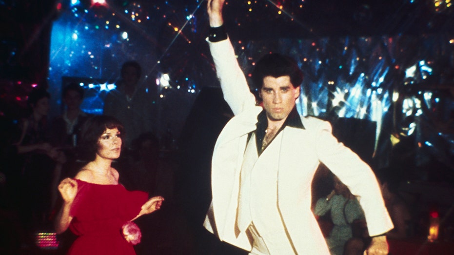 John Travolta dancing in a white suit