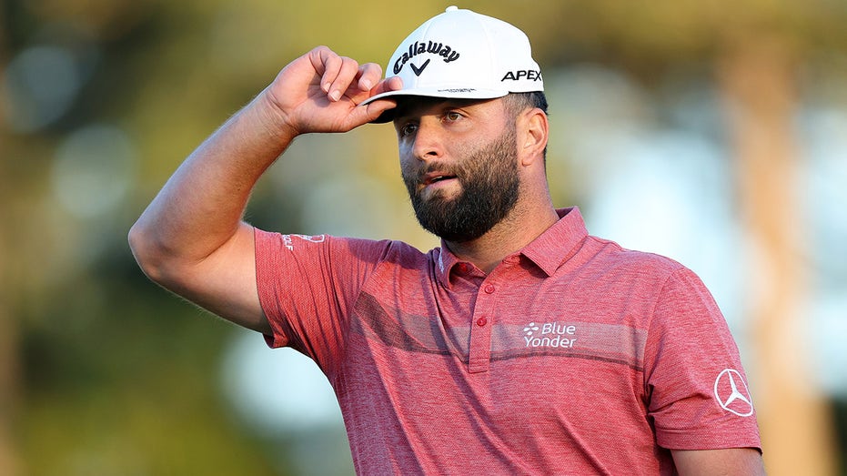 Jon Rahm tips his cap