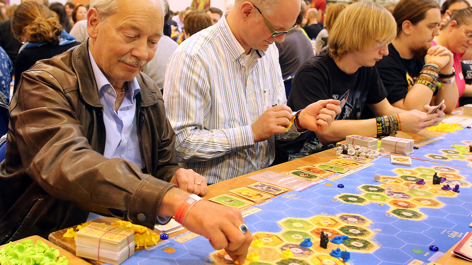 Catan creator Klaus Teuber plays game