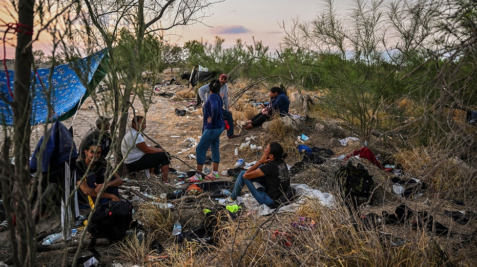 Migrants rest on Rio Grande island