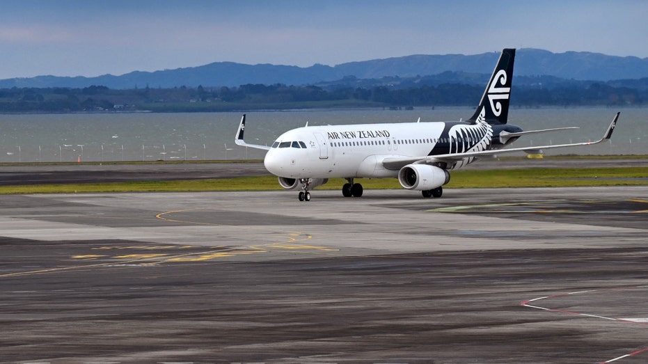 An Air New Zealand plane taxiing on a runway