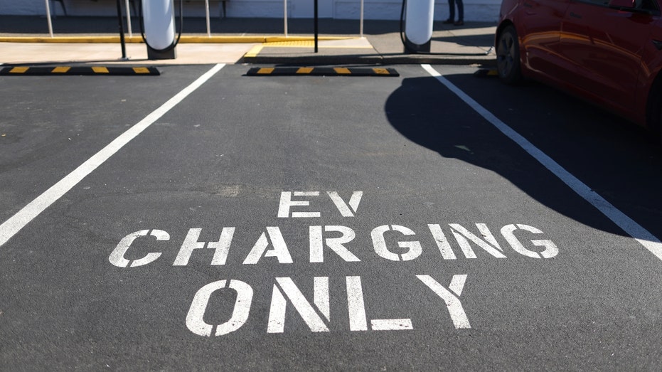 A Tesla Supercharger station sits empty