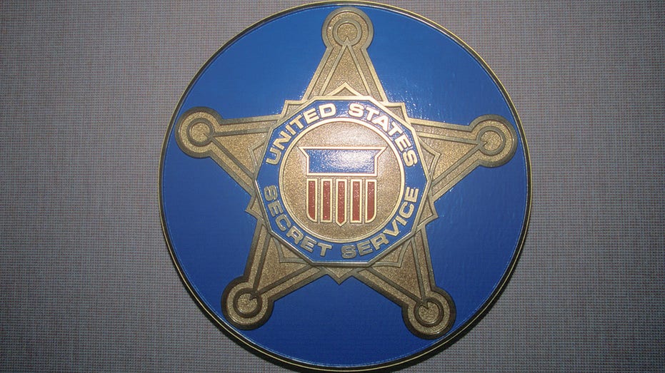 US Secret Service shield in blue circle