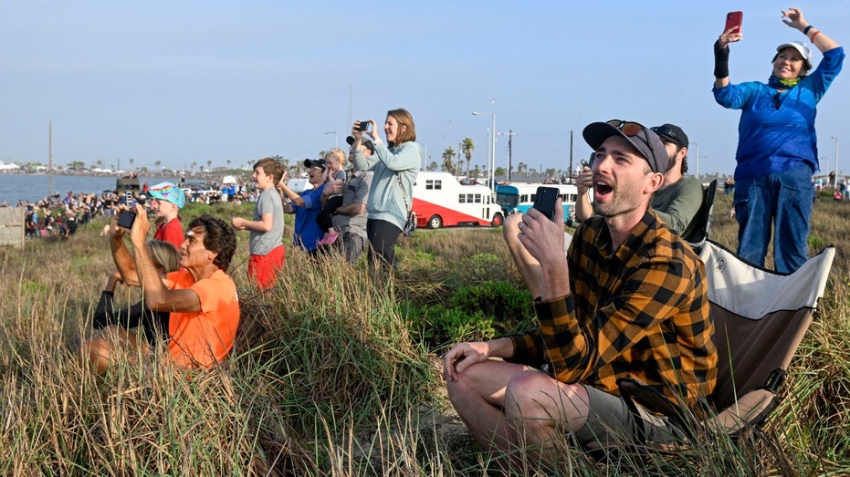 Spectators watch the Starship launch