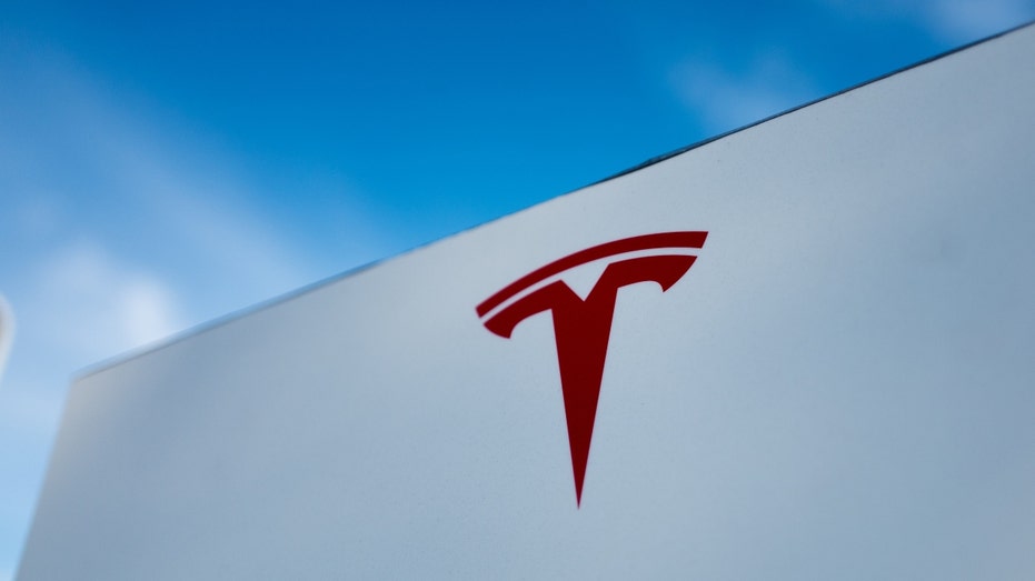 A close-up of the Tesla Motors logo on a building