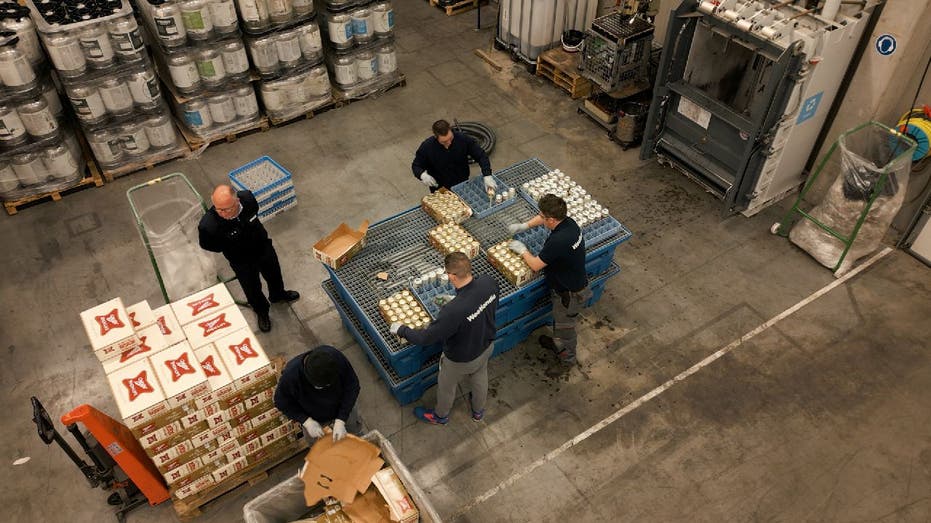 Westlandia factory worker prep Miller High Life beer for destruction