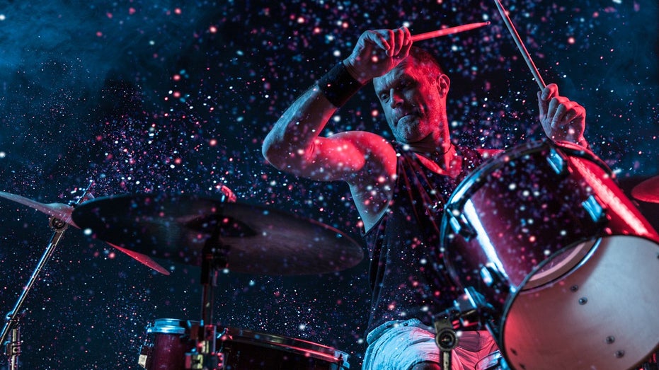 man playing drums