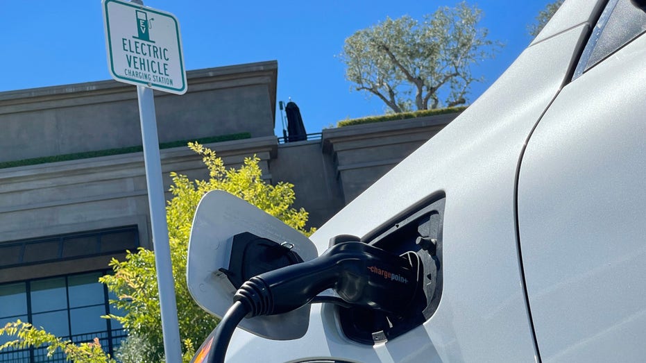 An electric car charges at a mall parking lot on June 27, 2022 in Corte Madera, California