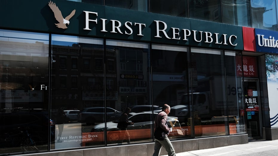 person walks past a First Republic Bank in Manhattan