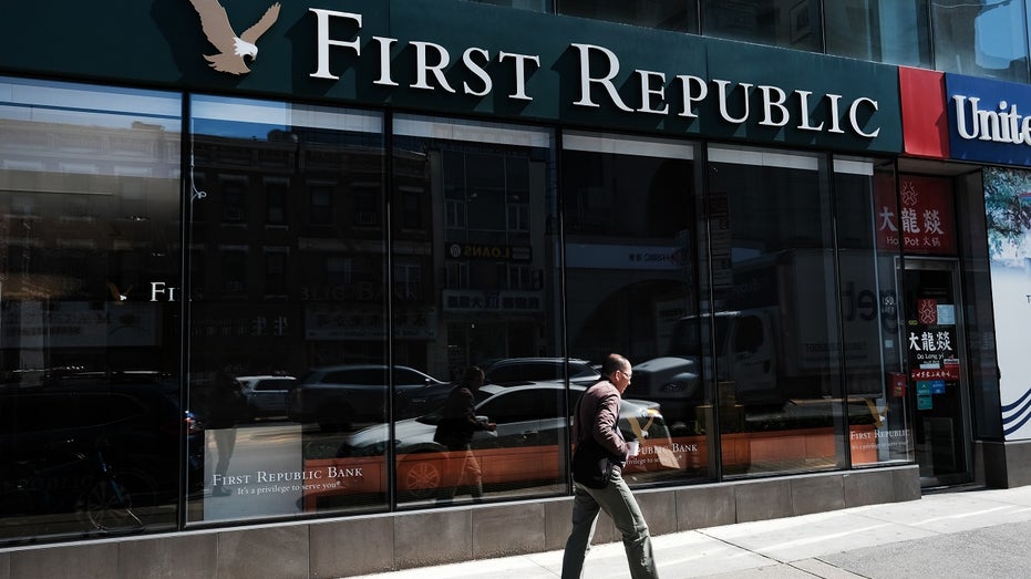 person walks past a First Republic Bank in Manhattan