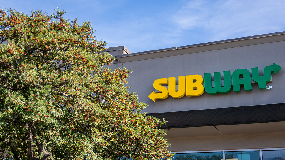 A Subway sandwich shop outside on a sunny day