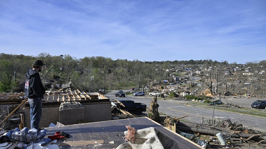 Arkansas tornado victim looks at destruction